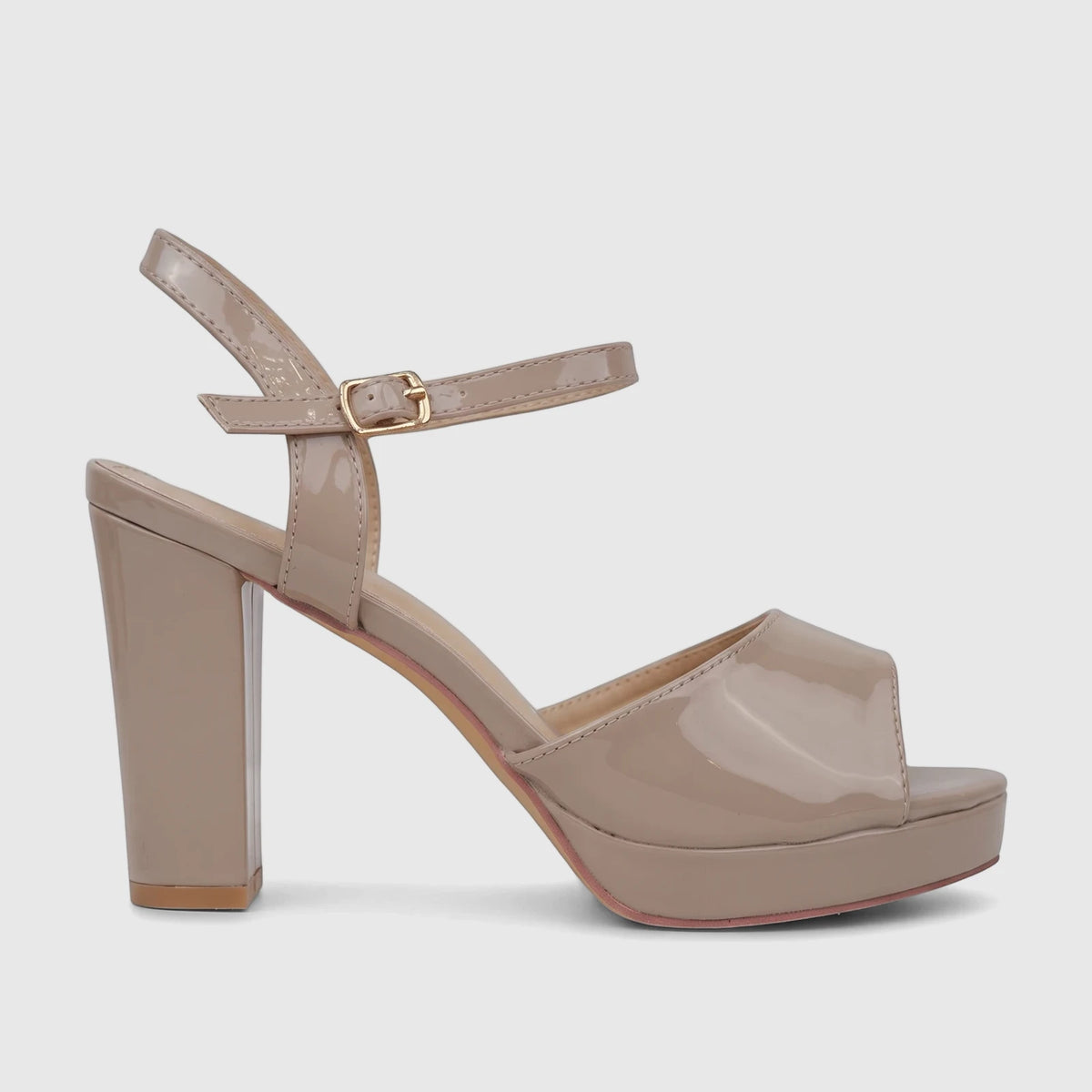 A single Bulbul Ladies Dress Block Heel Sandal in a shiny beige patent finish, showcasing its block heel and ankle strap
