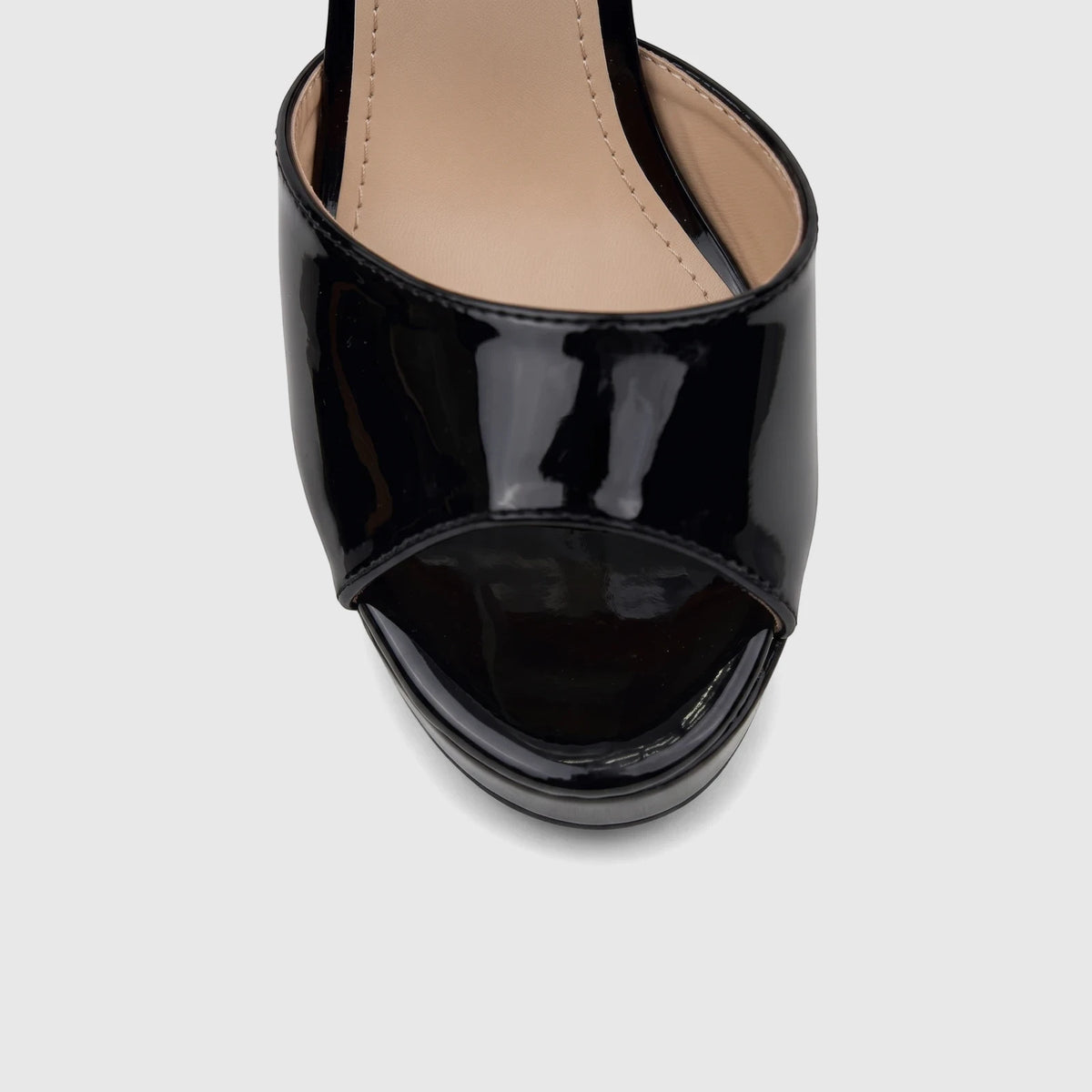 Close-up view of a Bulbul Ladies Dress Block Heel Sandal in black patent finish, featuring an open-toe design.