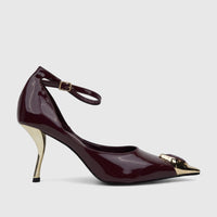 Side view of a Bulbul ladies' dress court shoe with an ankle strap, featuring a glossy purple finish, a golden sculptural