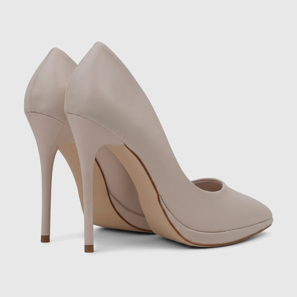 Pair of Bulbul Ladies Dress Court Shoe Beige LU058, elegant high heels with a pointed toe, viewed from a rear-side angle.