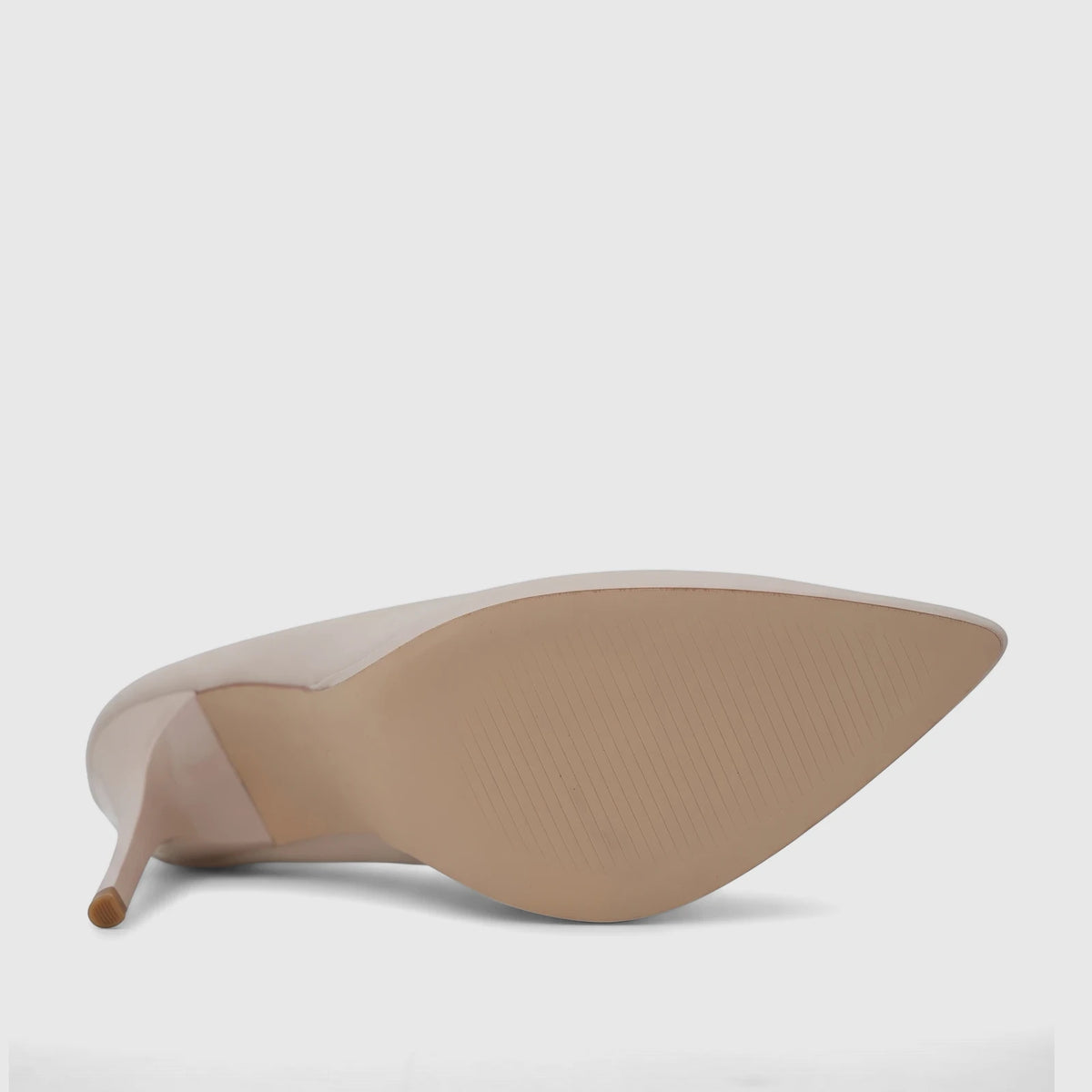 Bulbul Ladies Dress Court Shoe in beige, featuring a pointed toe and high heel, shown from the underside displaying the sole.