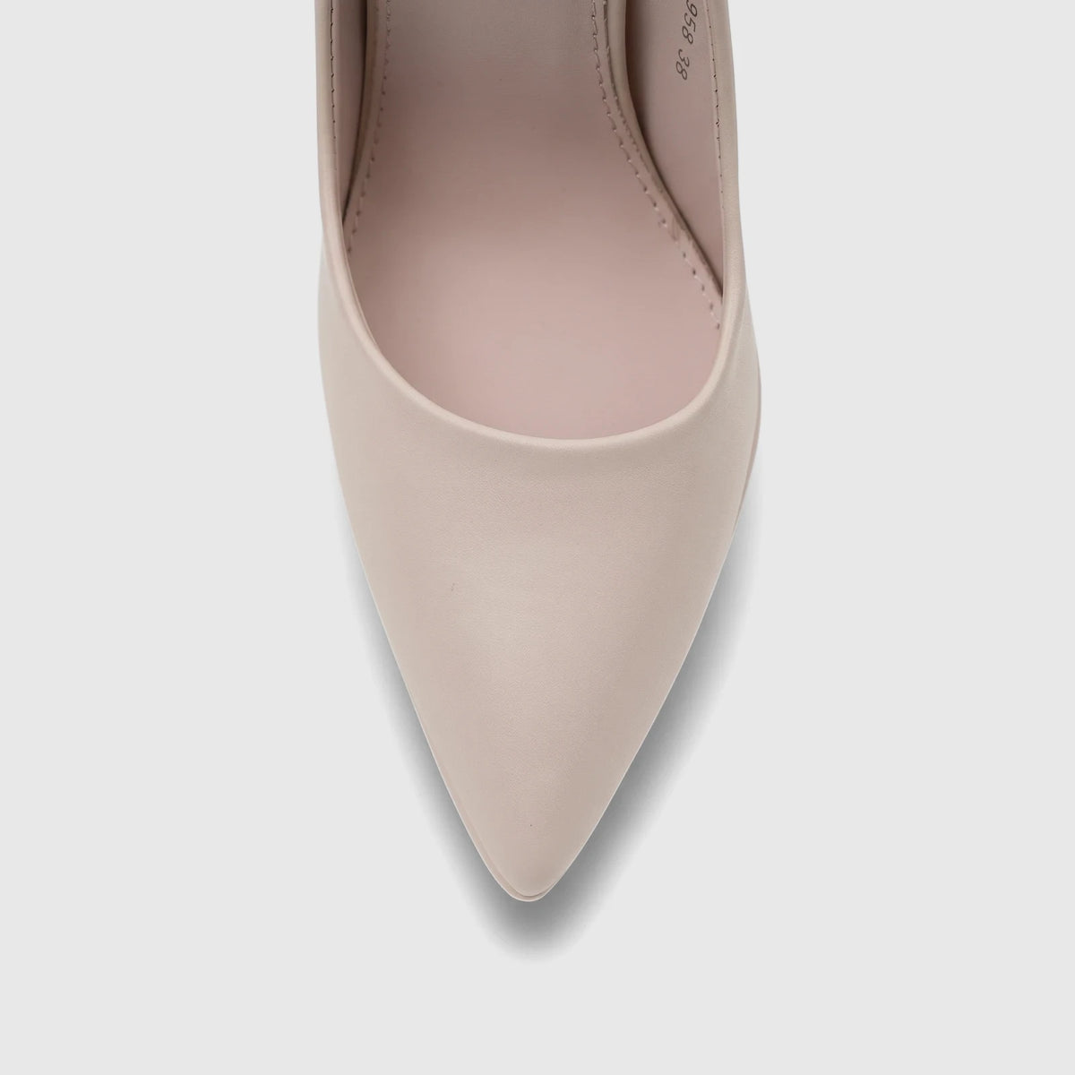 Close-up of a single Bulbul Ladies Dress Court Shoe in beige, featuring a sleek pointed toe design and smooth finish.