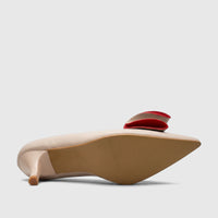 Bulbul Ladies Dress Court Shoe in beige, featuring a pointed toe, kitten heel, and a prominent red bow accent, viewed from