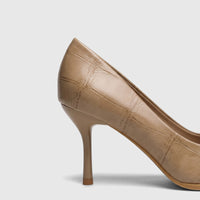 Close-up of a beige Bulbul Ladies Dress Court Shoe with a crocodile-embossed texture and stiletto heel.