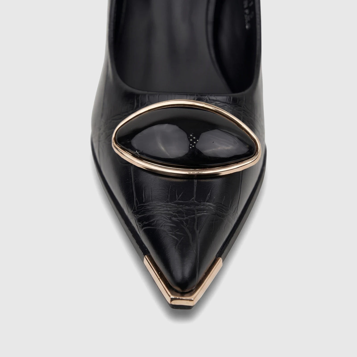 Close-up of a black croc-embossed Bulbul ladies dress court shoe with a pointed toe and gold-tone hardware detailing on the