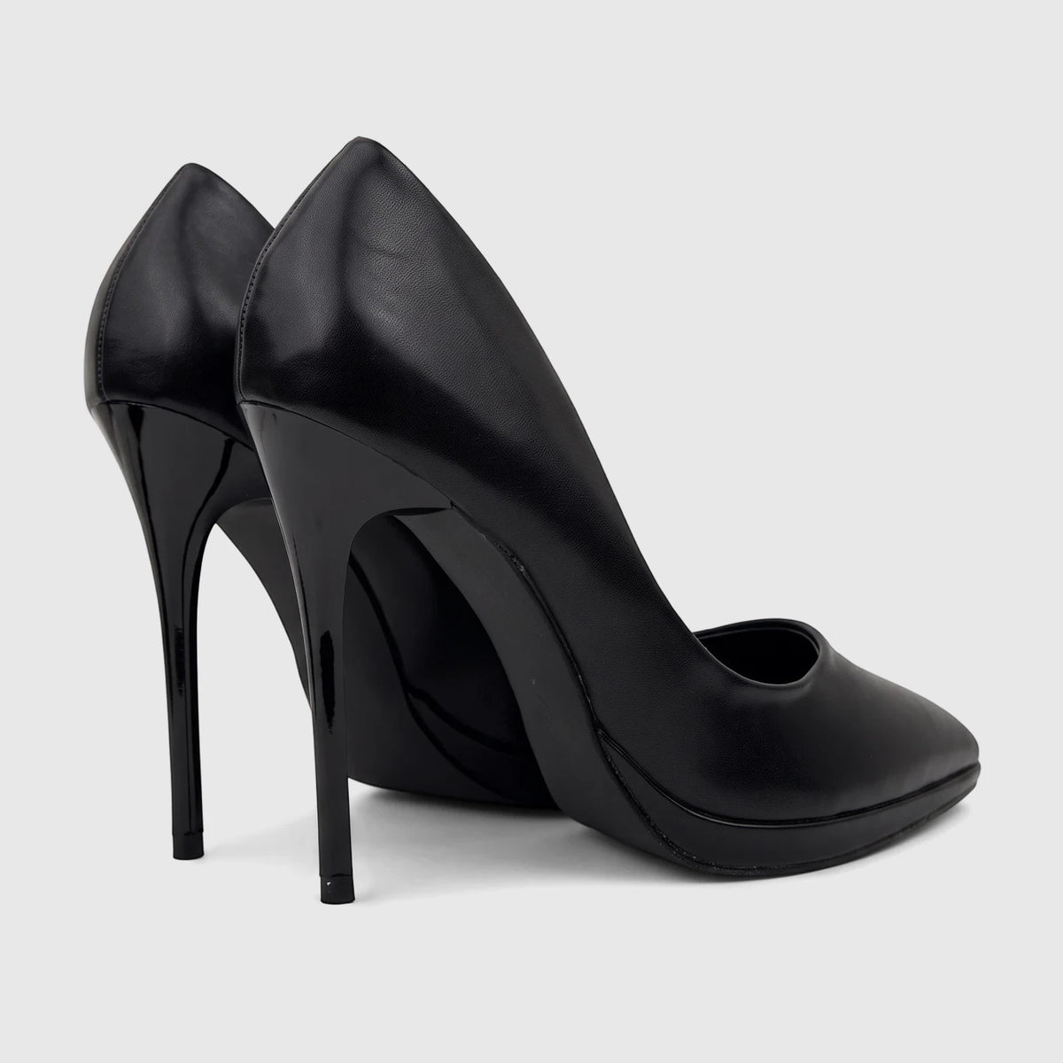 A pair of Bulbul Ladies Dress Court Shoes in black leather, featuring high heels and a sleek design, viewed from a side