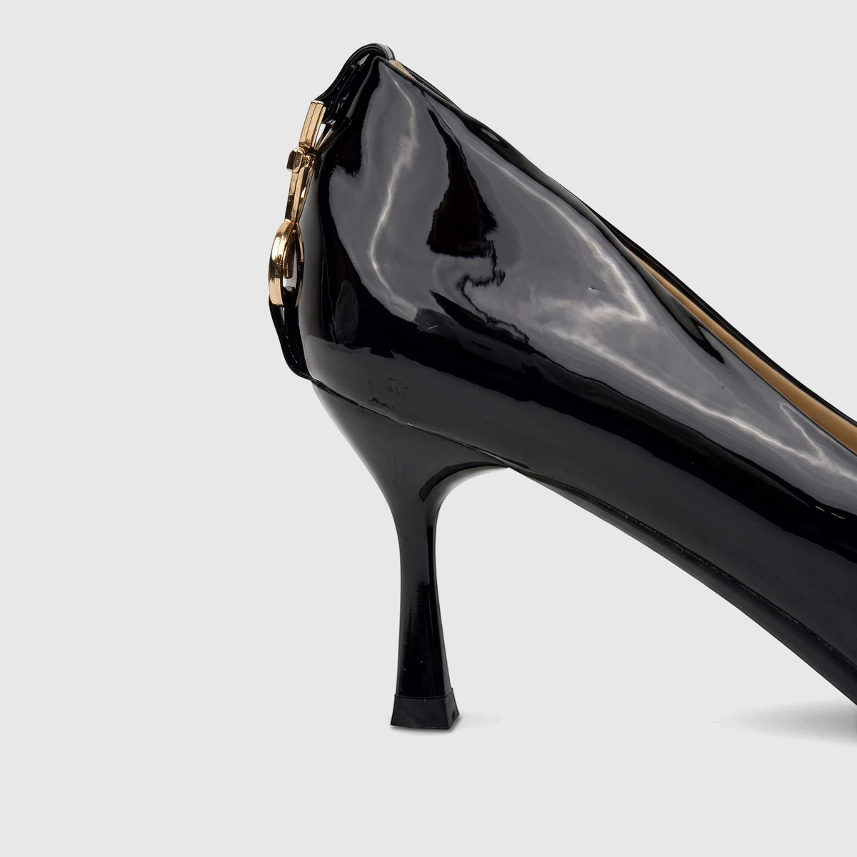 Bulbul Ladies Dress Court Shoe in black patent leather with a stiletto heel and elegant gold-tone hardware detail.