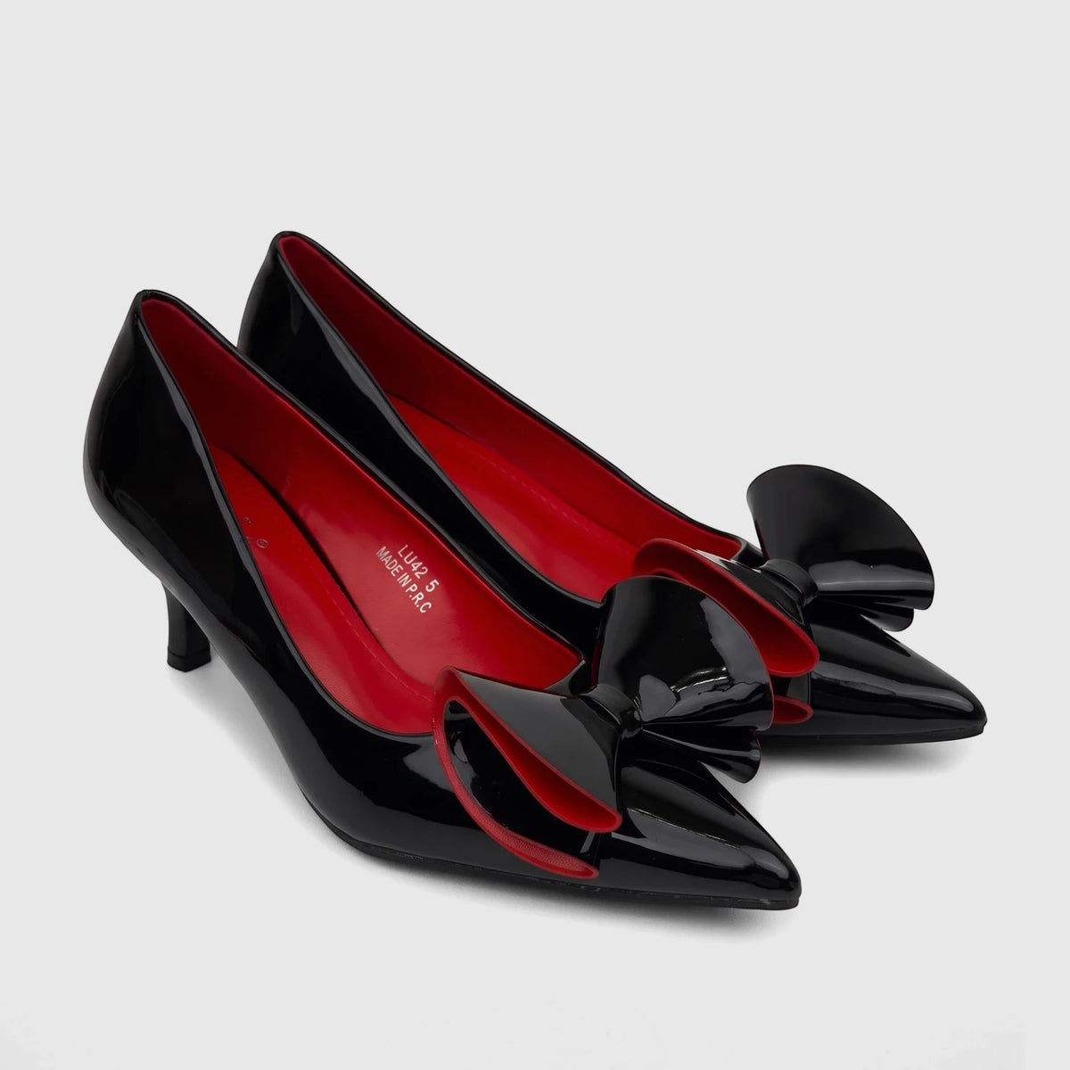 Bulbul Ladies Dress Court Shoe With Bow Black Patent LU042. Black patent leather pointed-toe heels with red interiors and