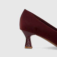 Burgundy ladies dress court shoe with a textured upper and a stylish kitten heel adorned with silver rhinestones.