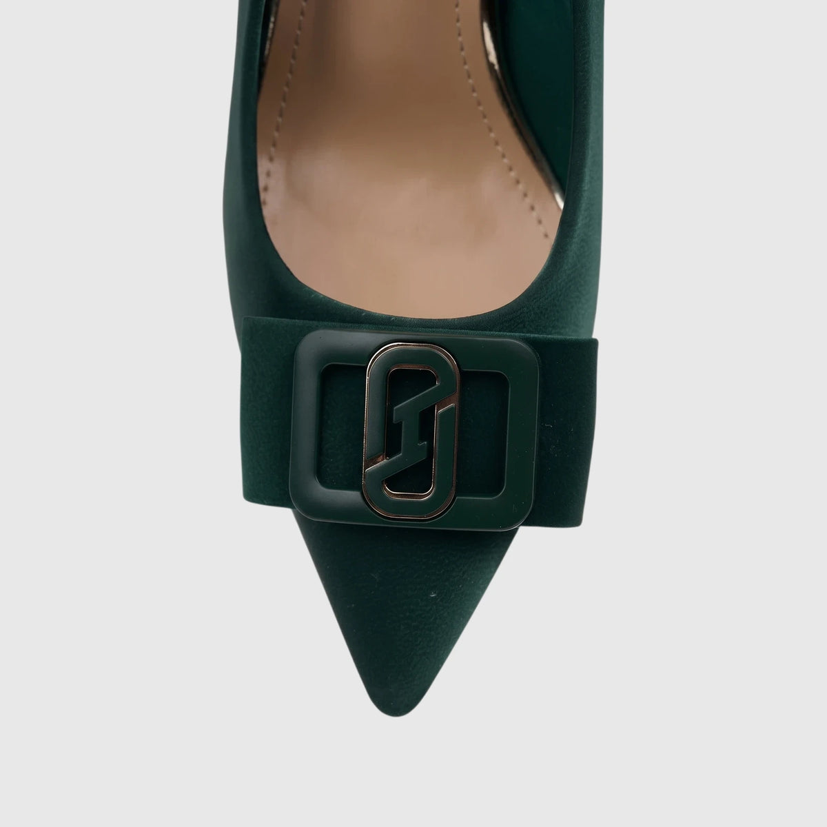 A close-up of a deep green Bulbul Ladies Dress Court Shoe with a pointed toe and a prominent decorative buckle on the vamp,