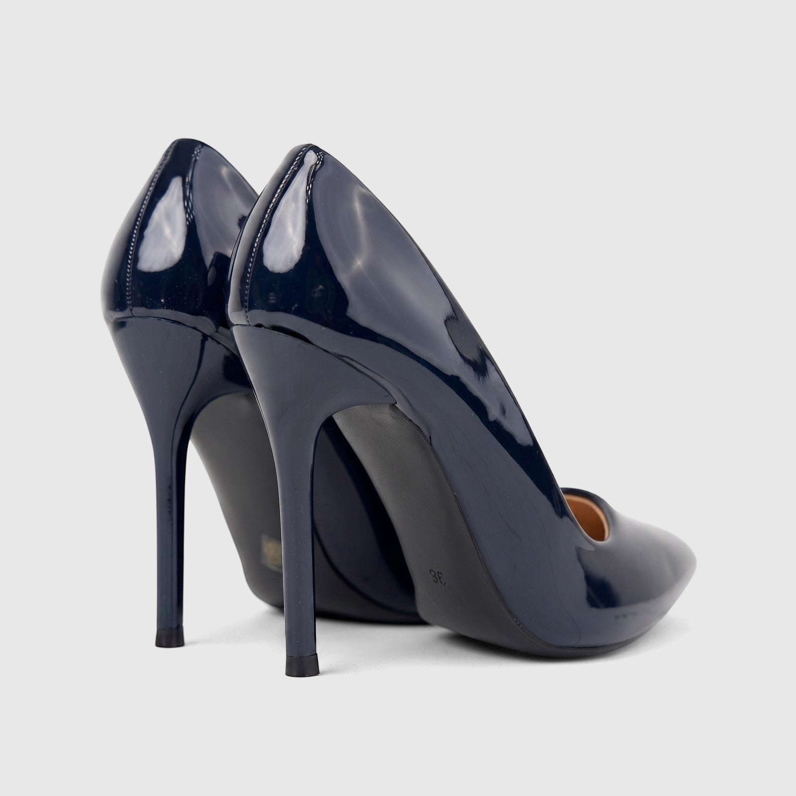 A pair of glossy navy blue patent leather Bulbul Ladies Dress Court Shoes, LU030 model, with high stiletto heels, shown from