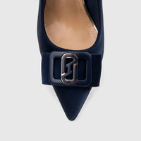Close-up of a navy Bulbul ladies' dress court shoe with a pointed toe and decorative rectangular buckle on the vamp.