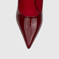 Close-up top view of a single red patent leather Bulbul Ladies Dress Court Shoe, featuring a sharp point-toe design.