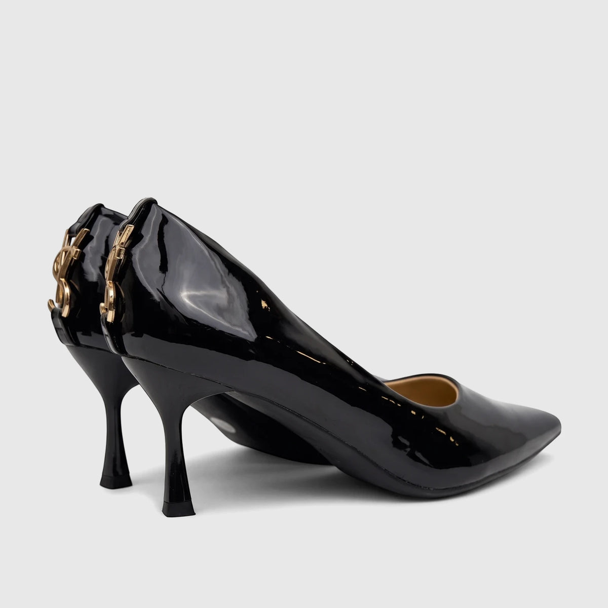 Black patent leather Bulbul Ladies Dress Court Shoes with pointed toes, stiletto heels, and gold-toned YSL logo on the back.