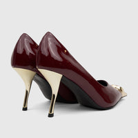 Two elegant Bulbul ladies' dress court shoes in glossy burgundy patent leather with striking gold stiletto heels and toe