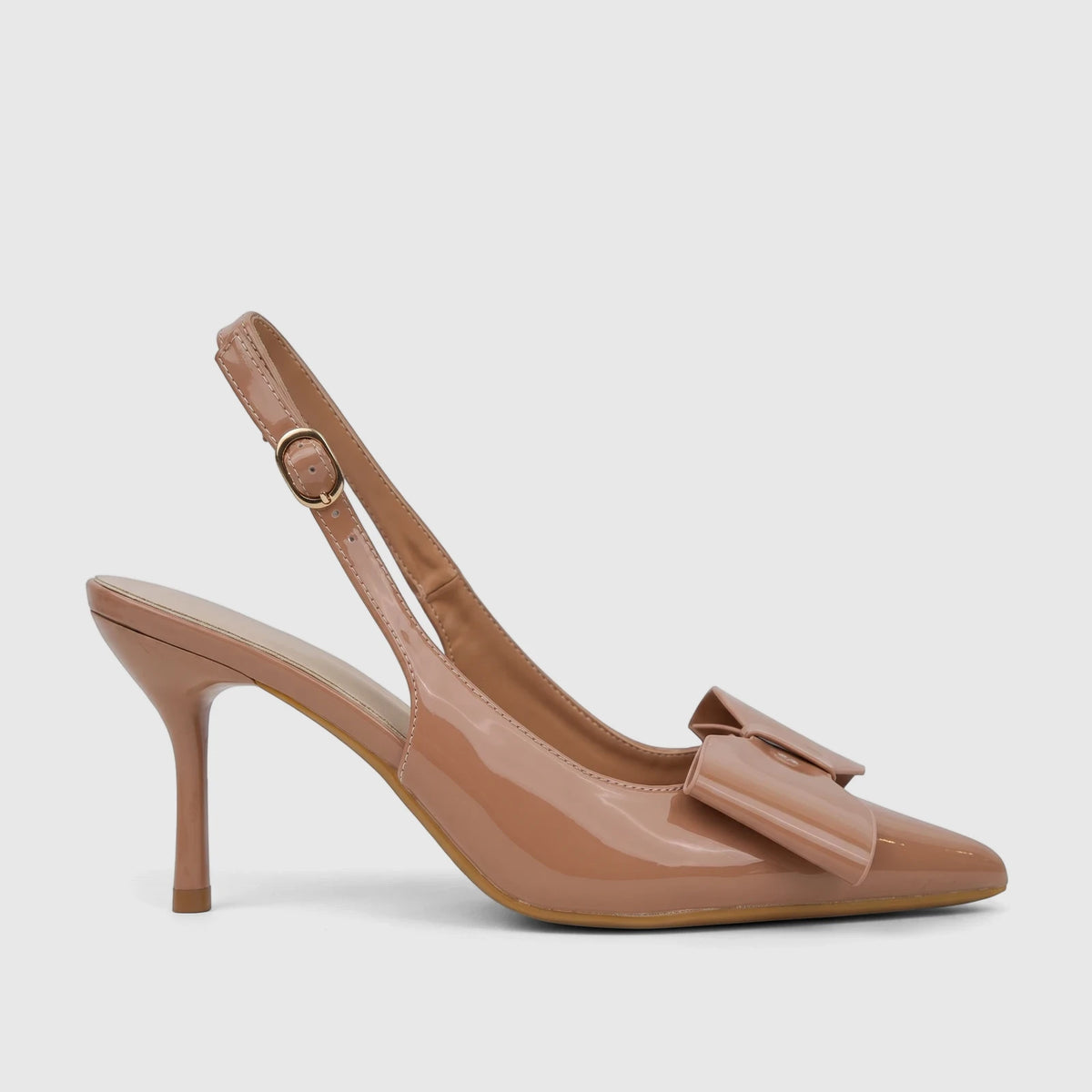 Elegant beige patent leather slingback court shoe with a pointed toe, decorative bow, and slender high heel.