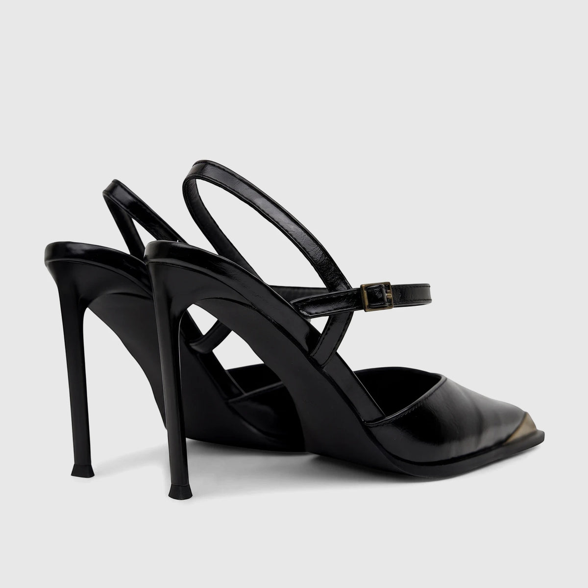 Black patent leather Bulbul Ladies Dress Slingback Court shoes with high stiletto heels and gold-tone toe detail, back-side