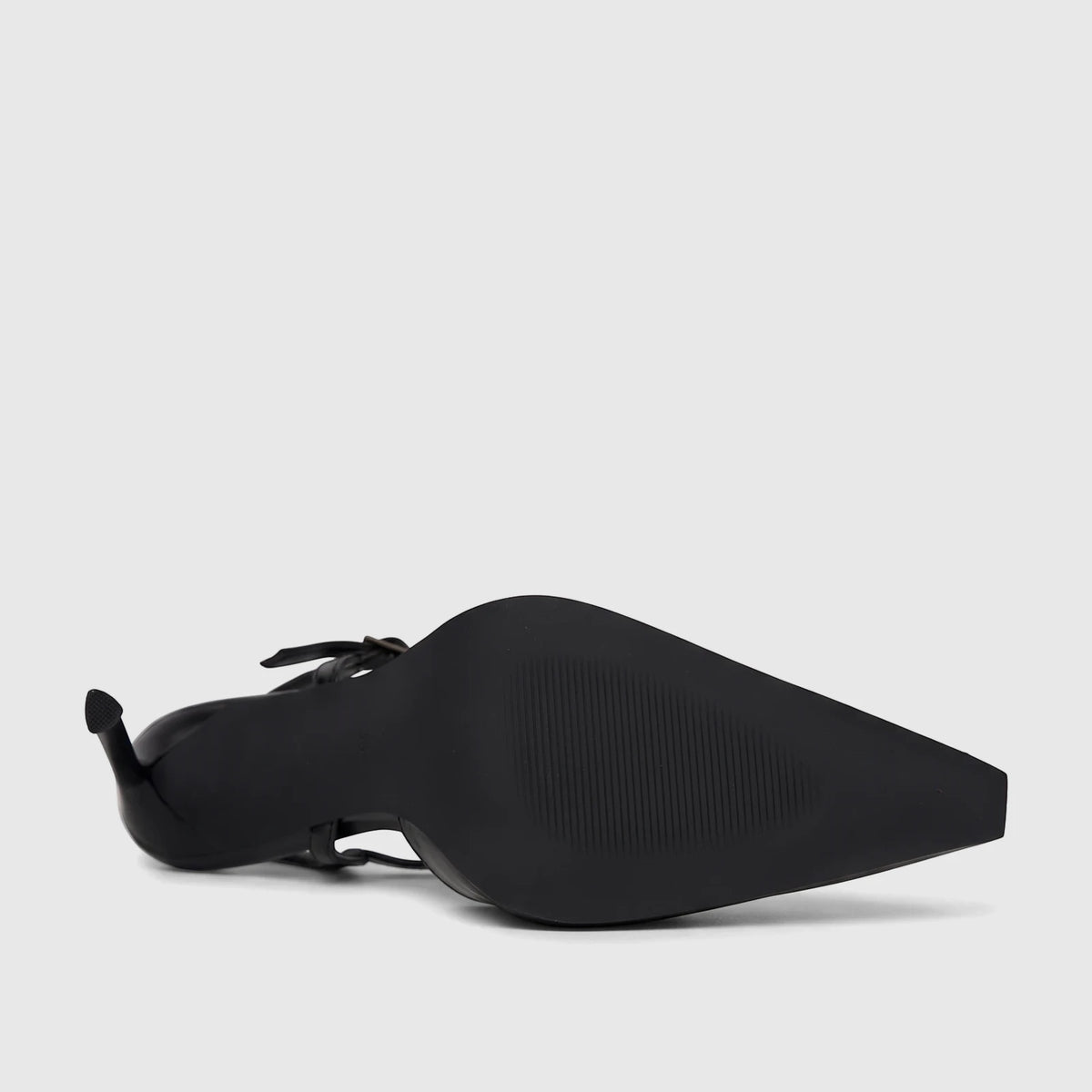 Black Bulbul Ladies Dress Slingback Court shoe with a pointed toe and stiletto heel, showcasing the textured sole.
