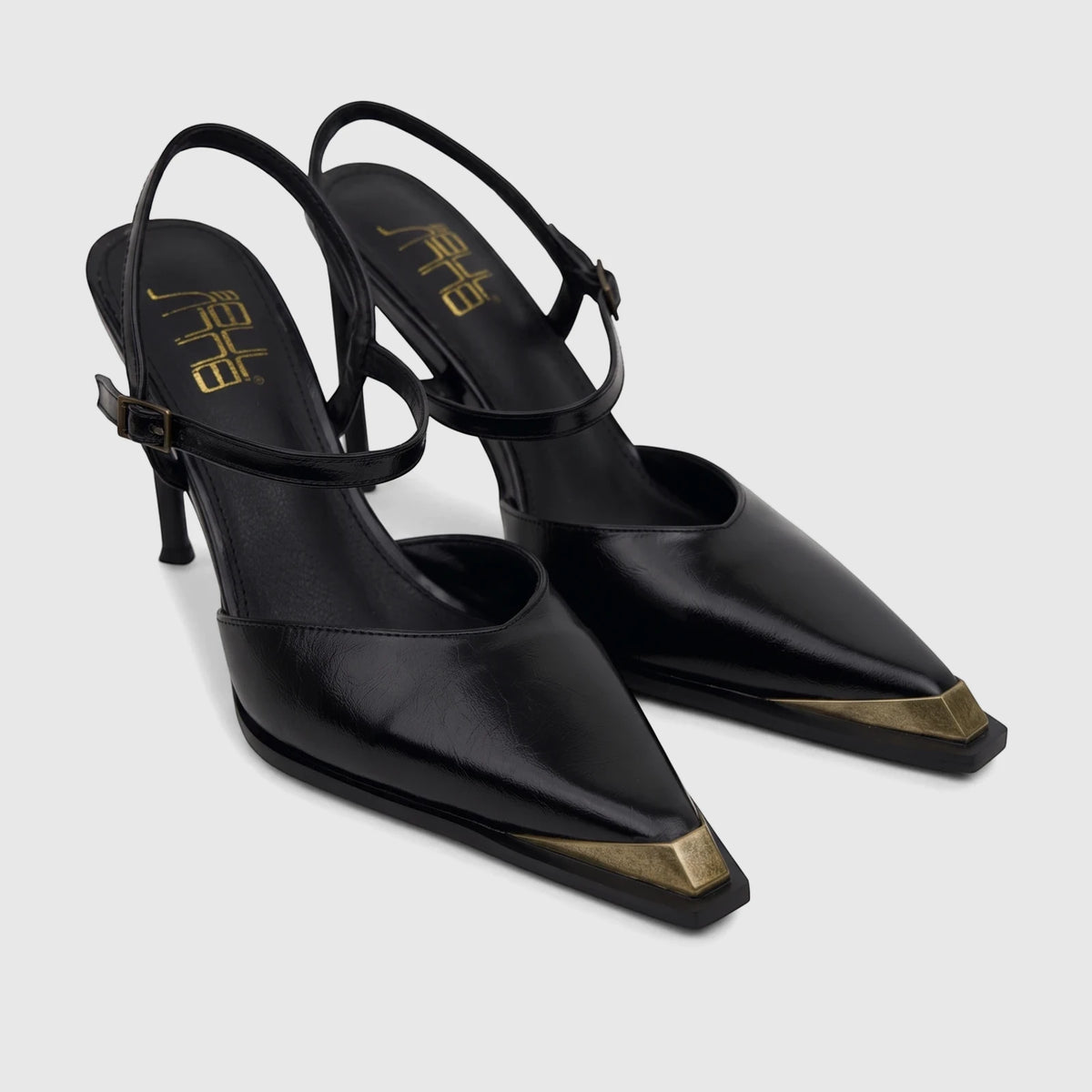 Pair of black slingback court heels for ladies by Bulbul, featuring pointed toes with gold-tone caps and thin stiletto heels.