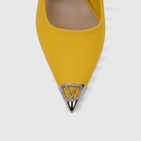 Close-up of a yellow Bulbul Ladies Dress Slingback Court shoe, featuring a pointy toe adorned with a silver
