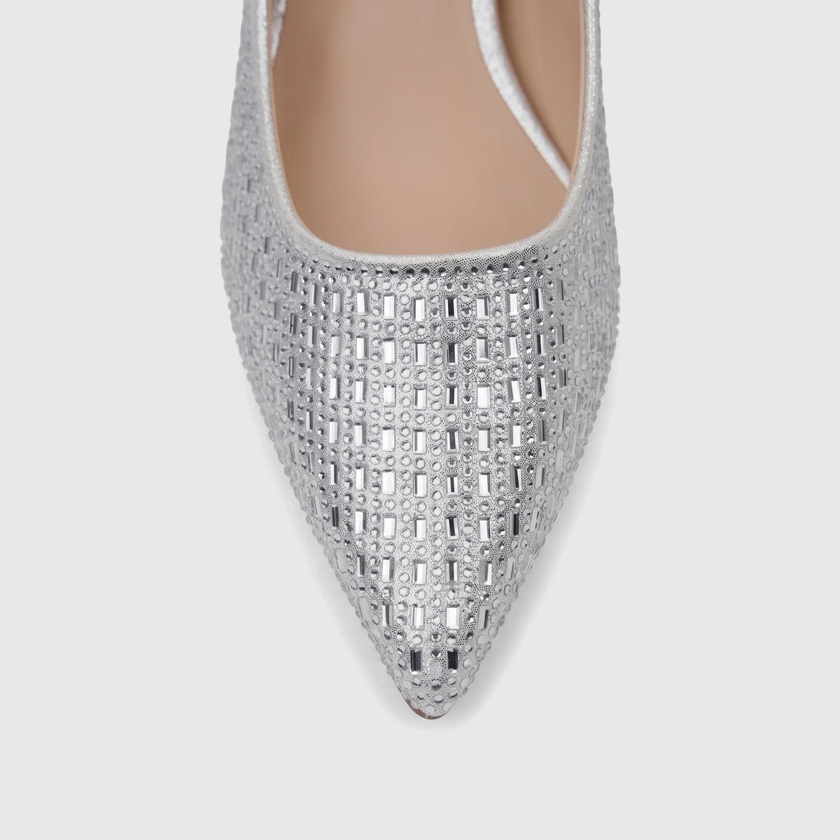 Close-up of a ladies' silver evening block heel court shoe, detailed with sparkling rhinestones across the pointed toe.