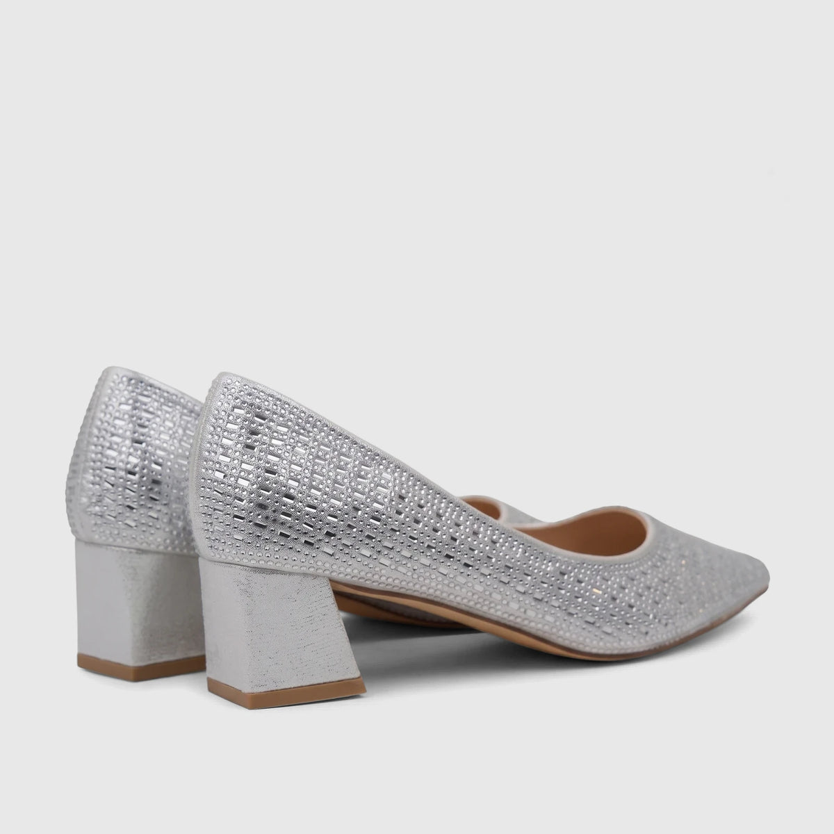 A pair of silver Bulbul Ladies Evening Block Heel Court Shoes, sparkling with rhinestone embellishments, shown from the side.