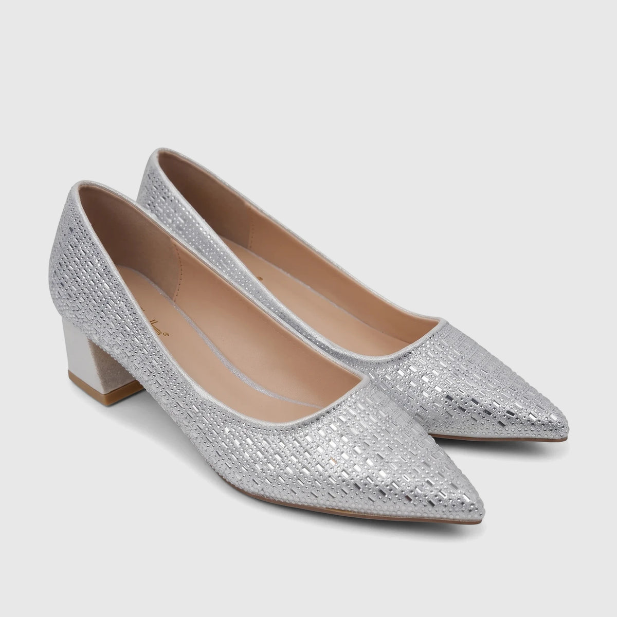 A pair of silver Bulbul ladies evening court shoes with embellished pointed toes and matching silver block heels, displayed