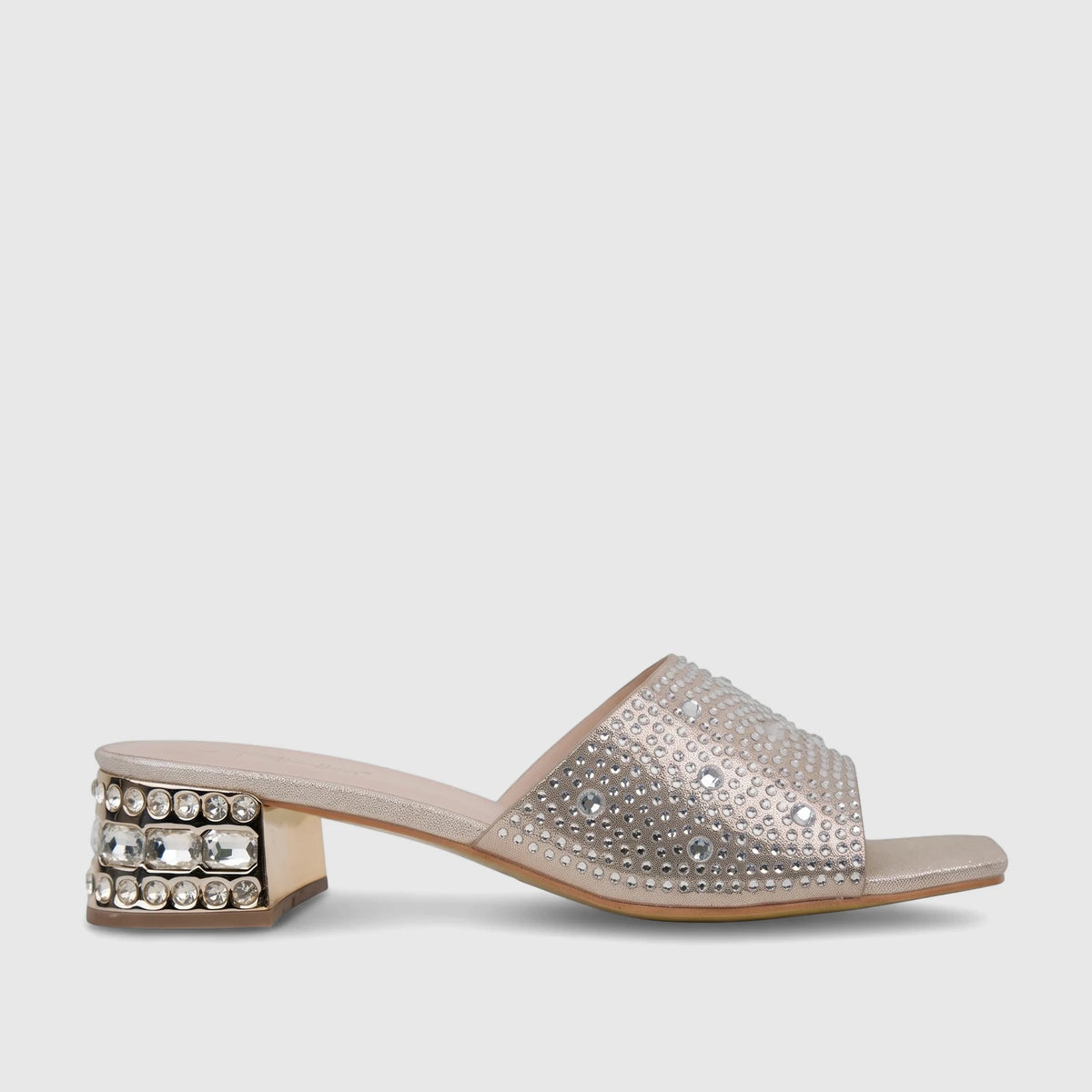 Gold block heel mule shoe with rhinestone-embellished strap and heel, in a side view for evening wear.