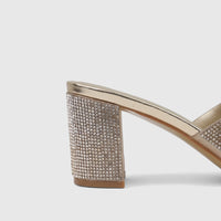 Close-up of a single Bulbul Ladies Evening Block Heel Mule in gold, with a rhinestone-embellished block heel and upper.
