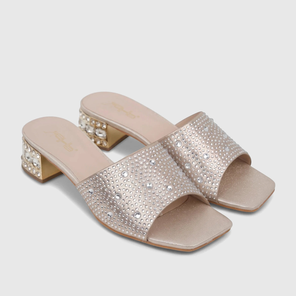 Pair of Bulbul ladies' evening block heel mules in gold, featuring sparkling rhinestone-covered straps and heels, presented