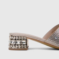 Gold block heel mule with crystal embellishments on the heel, designed for ladies' evening wear.