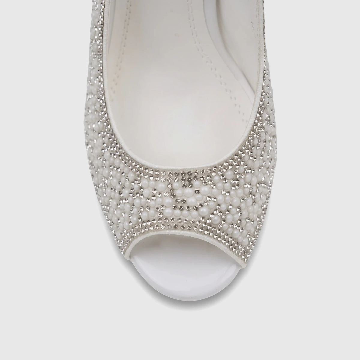 Close-up of a white Bulbul Ladies Evening Block Heel Peep Toe Sandal, embellished with pearls and rhinestones.