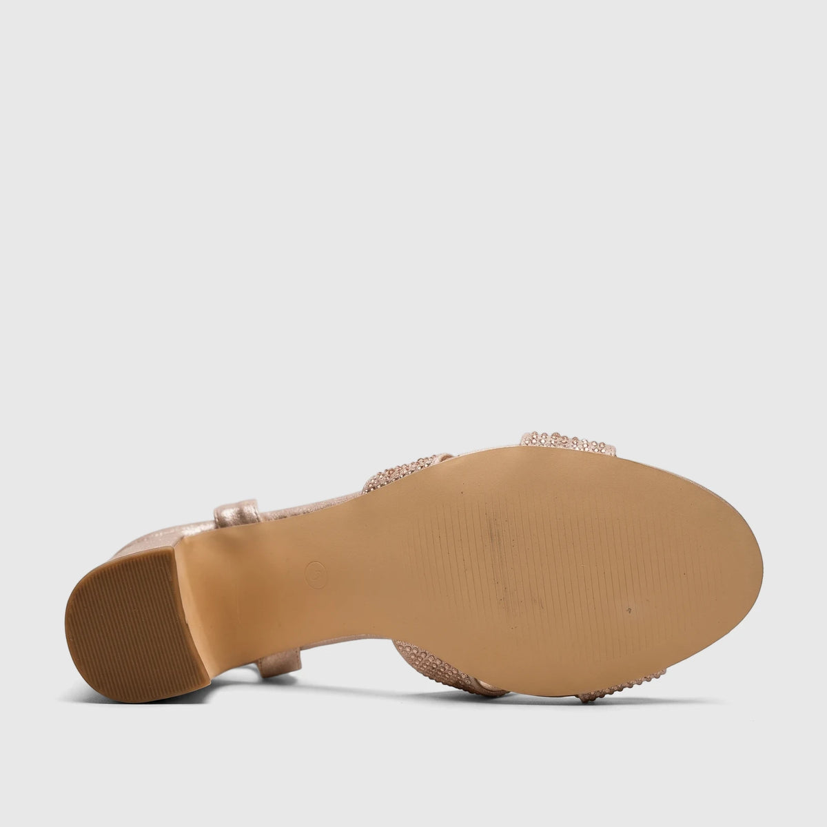Bottom view of a Bulbul Ladies Evening Block Heel Sandal in champagne, showcasing the textured sole and block heel.
