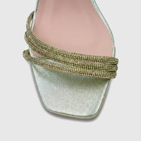 Close-up of a green Bulbul Ladies Evening Block Heel Sandal featuring sparkling rhinestone straps and a modern square toe