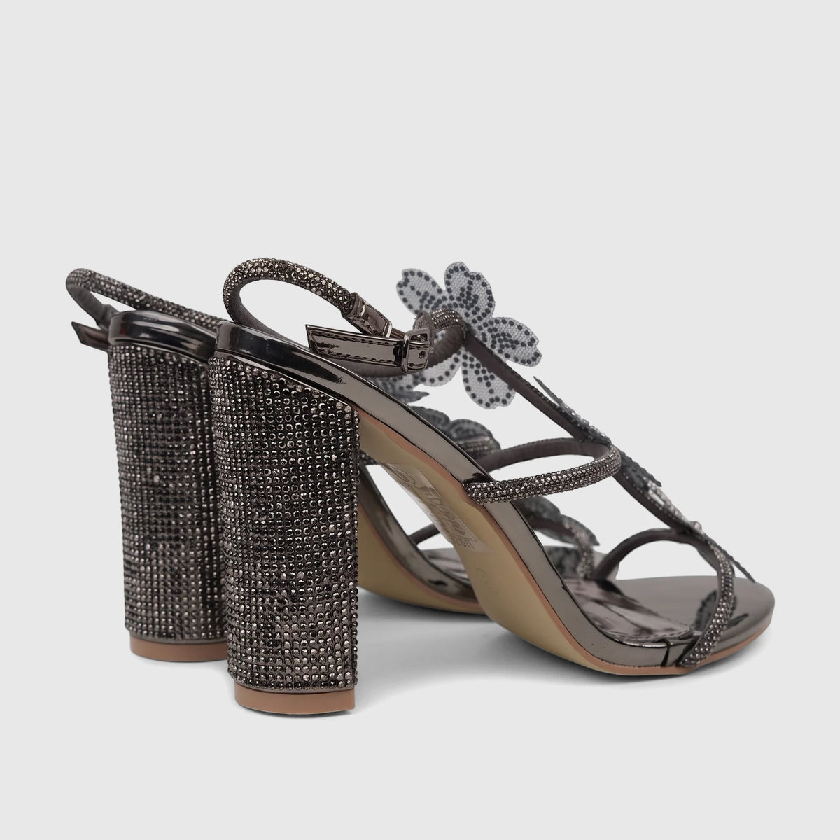 Pair of Bulbul Ladies Evening Block Heel Sandals in gunmetal, with rhinestone-embellished block heels and floral strap