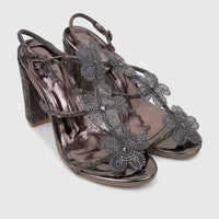 Pair of Bulbul Ladies Evening Block Heel Sandals in metallic gunmetal. Features floral beaded embellishments and