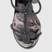 Close-up of a Bulbul Ladies Evening Block Heel Sandal in gunmetal with sparkling floral mesh details on a metallic finish.