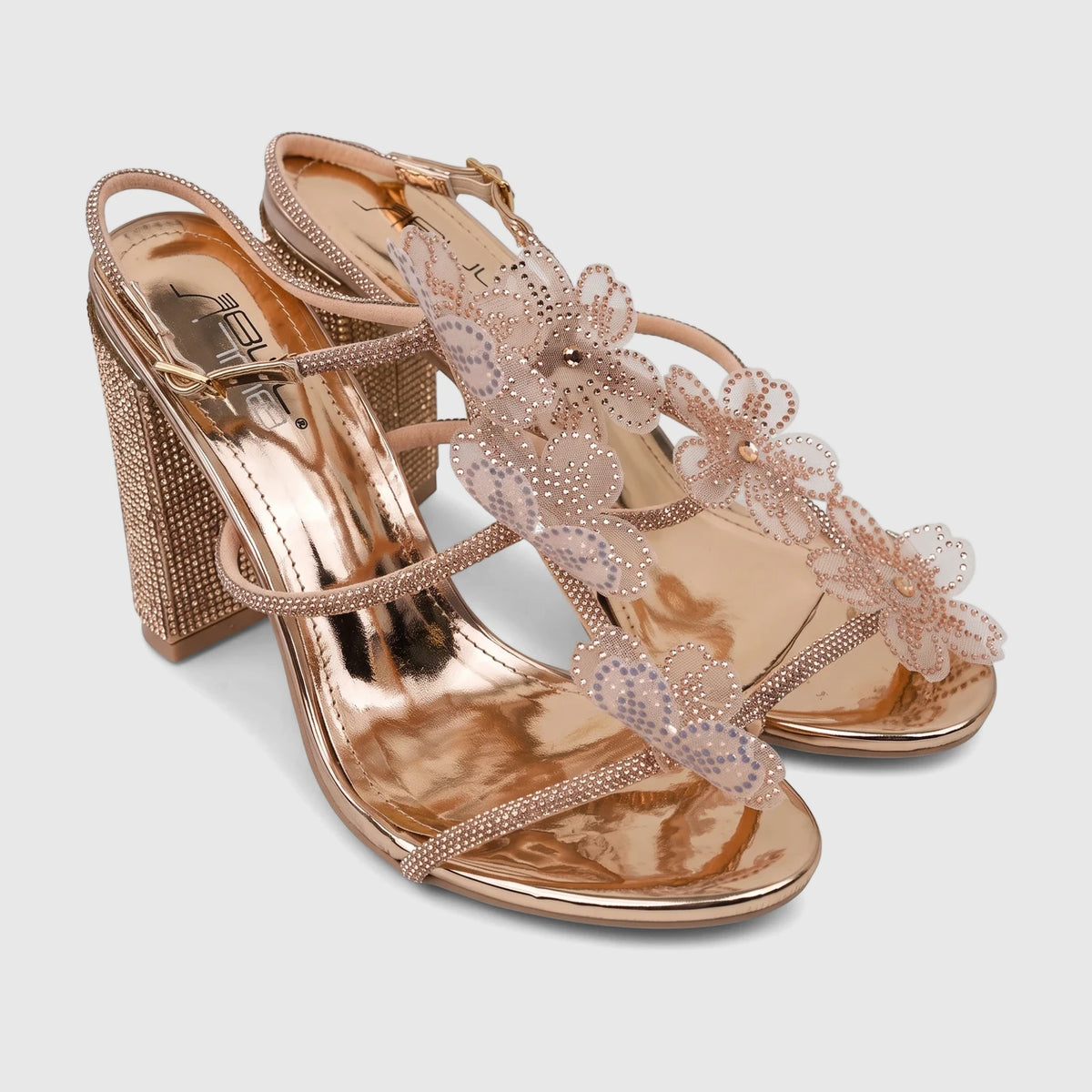 A pair of Bulbul Ladies Evening Block Heel Sandals in rose gold, featuring rhinestone-embellished straps and floral lace