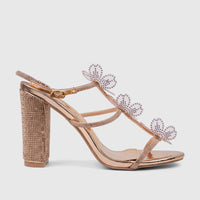 Rose gold Bulbul Ladies Evening Block Heel Sandal with rhinestone-covered heel and straps, and clear butterfly appliqués.
