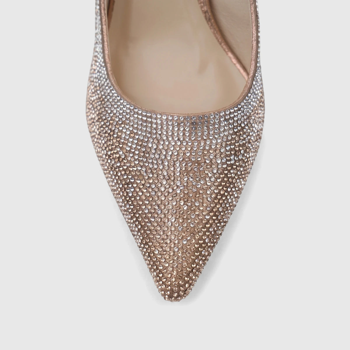 Close-up of a Bulbul Ladies Evening Court Shoe in champagne, featuring a pointed toe and entirely covered in sparkling