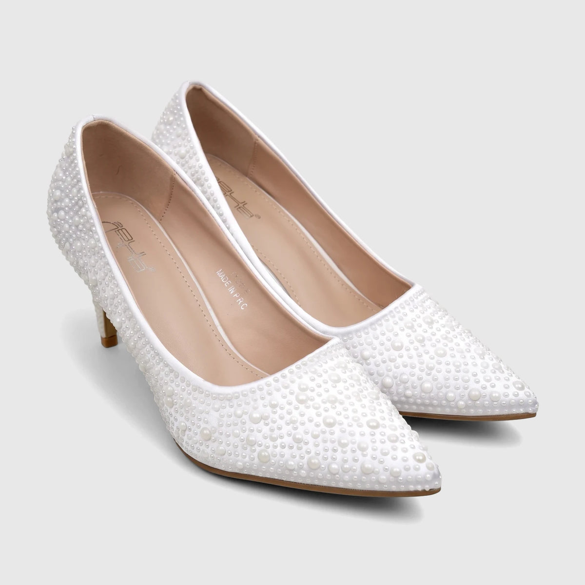A pair of white pearl-embellished Bulbul Ladies Evening Court Shoes with pointed toes and medium heels.