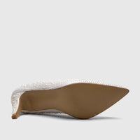 Underside view of a white pearl-embellished Bulbul Ladies Evening Court Shoe, showcasing the high heel and tan sole.
