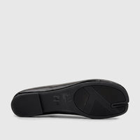 Bottom view of a black patent leather Bulbul Ladies Evening Pump, featuring a distinctive tabi split toe sole and textured