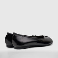 Pair of black patent leather Bulbul Ladies Evening Pumps, side view, featuring small decorative bows.