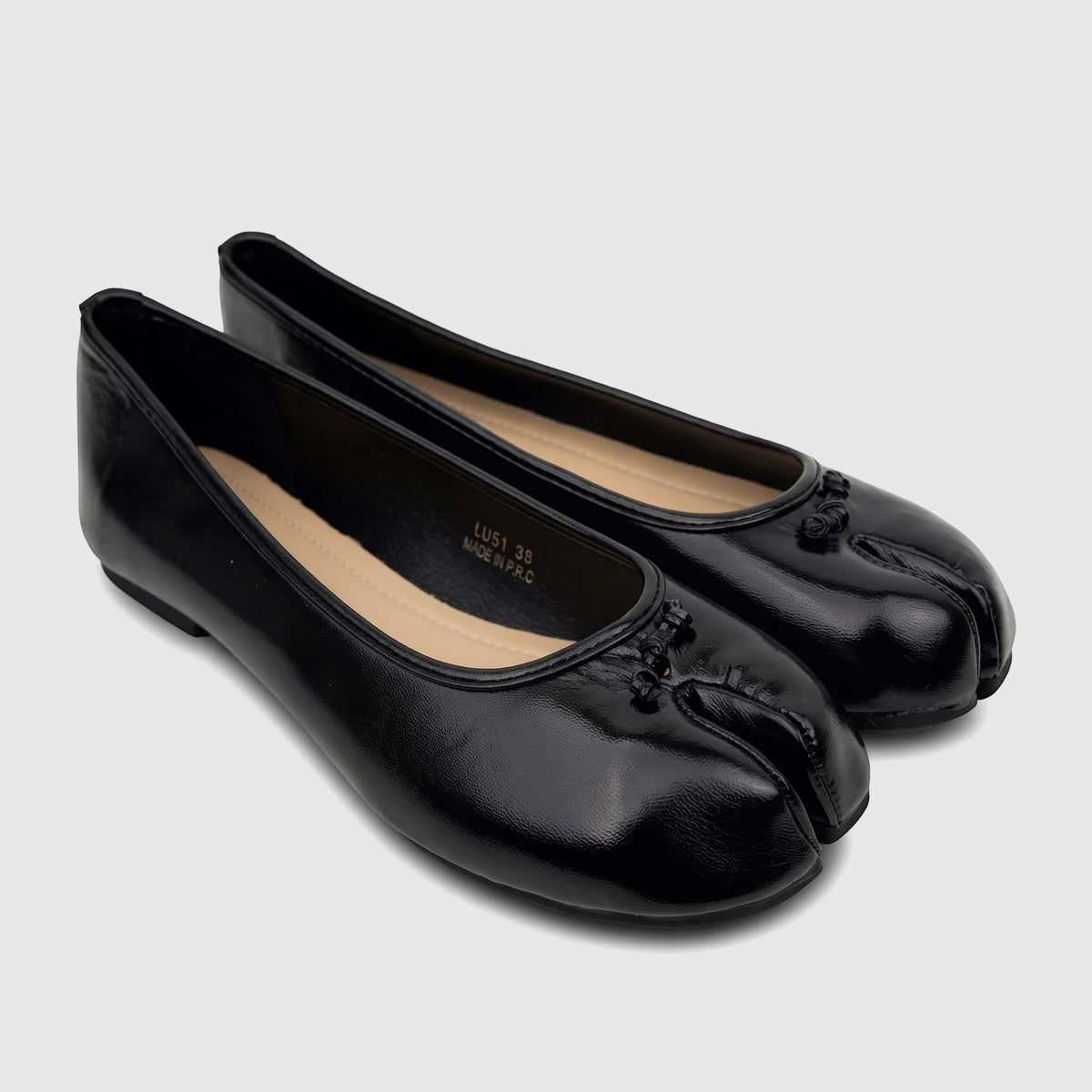 Pair of black patent leather-like Bulbul Ladies Evening Pump split-toe ballet flats, angled on a white surface, showcasing