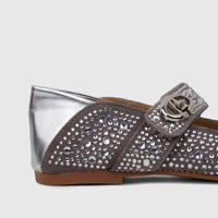 Side view of a Bulbul Ladies Evening Pump in grey, adorned with sparkling rhinestones and a striking silver metallic heel.