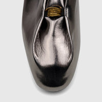 Close-up of a Bulbul Ladies Evening Pump in gunmetal metallic finish, featuring a gathered design and gold ring