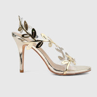 Bulbul Ladies Evening Sandal in gold, featuring delicate metallic leaf straps, clear bands, and a stiletto heel,