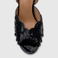 Close-up of a black sequined Bulbul Ladies Evening Slingback Sandal with a patent leather toe.