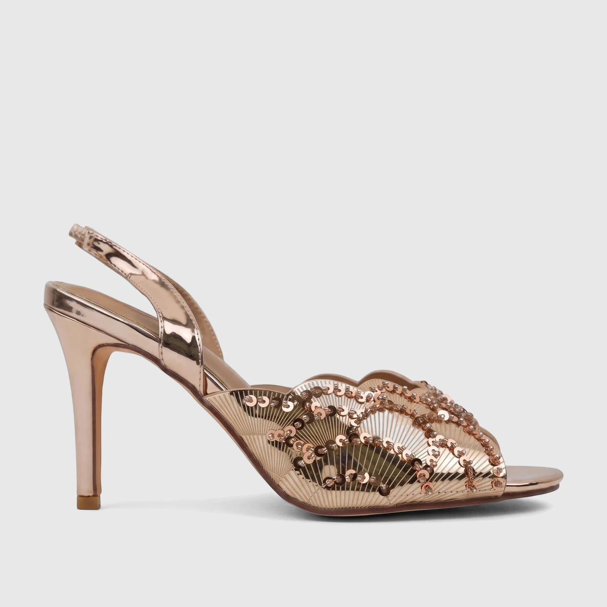 Champagne metallic slingback sandal with fan-shaped sequin details and a high heel, photographed from the side.